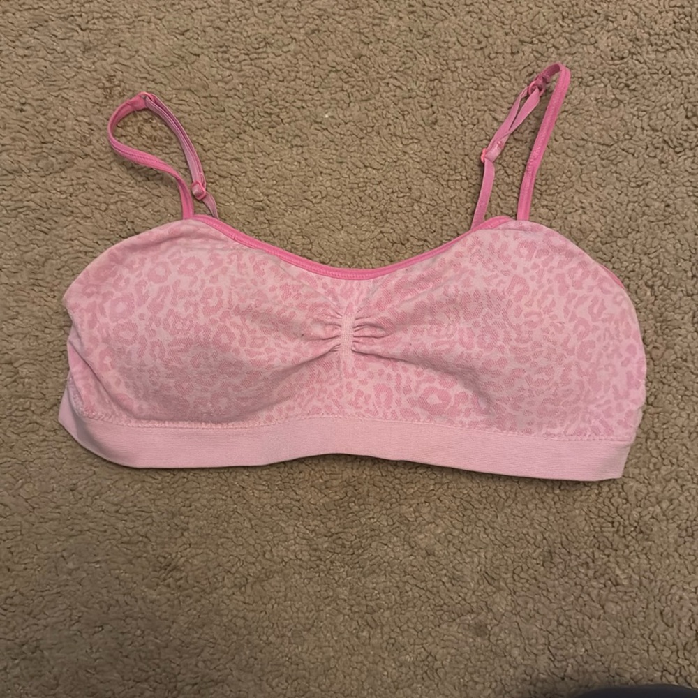 a kids pink, leopard print sports bra. brand is fruit of the loom, size 36